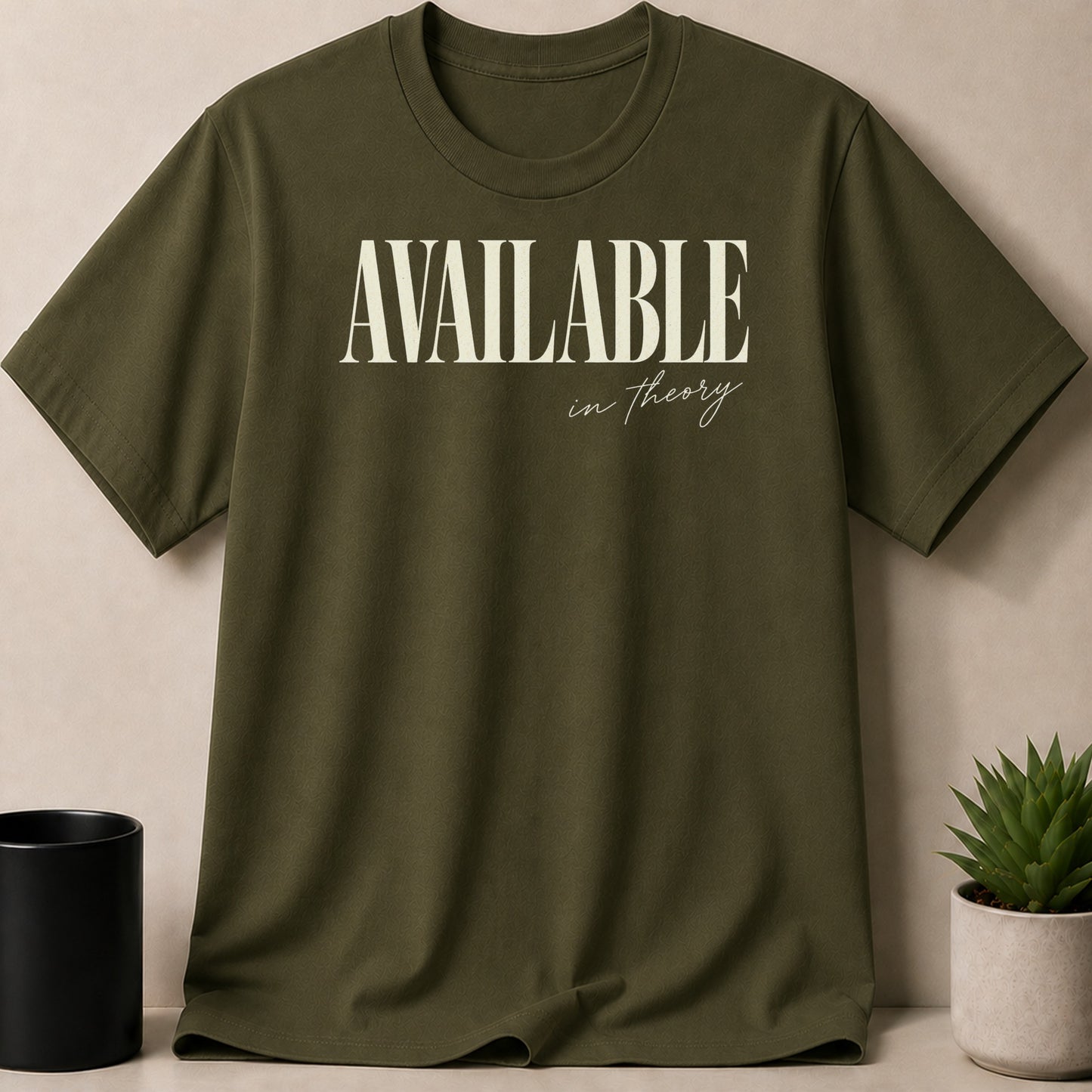 Olive green t-shirt with "AVAILABLE in theory" text graphic.