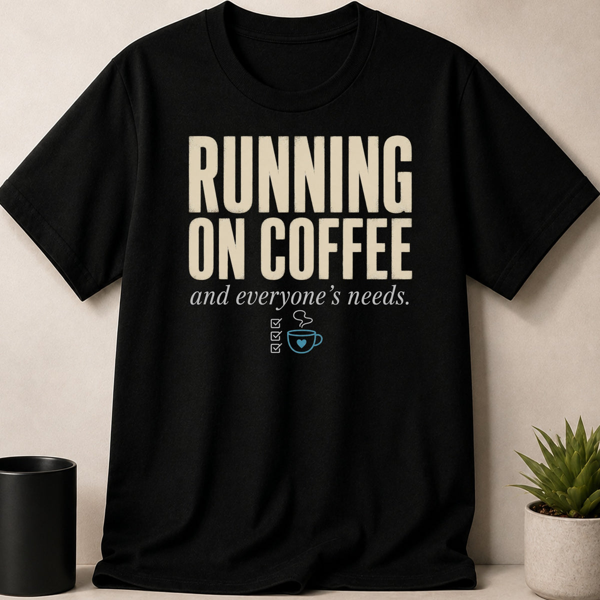 Black t-shirt with "RUNNING ON COFFEE and everyone's needs." text and coffee cup icon.
