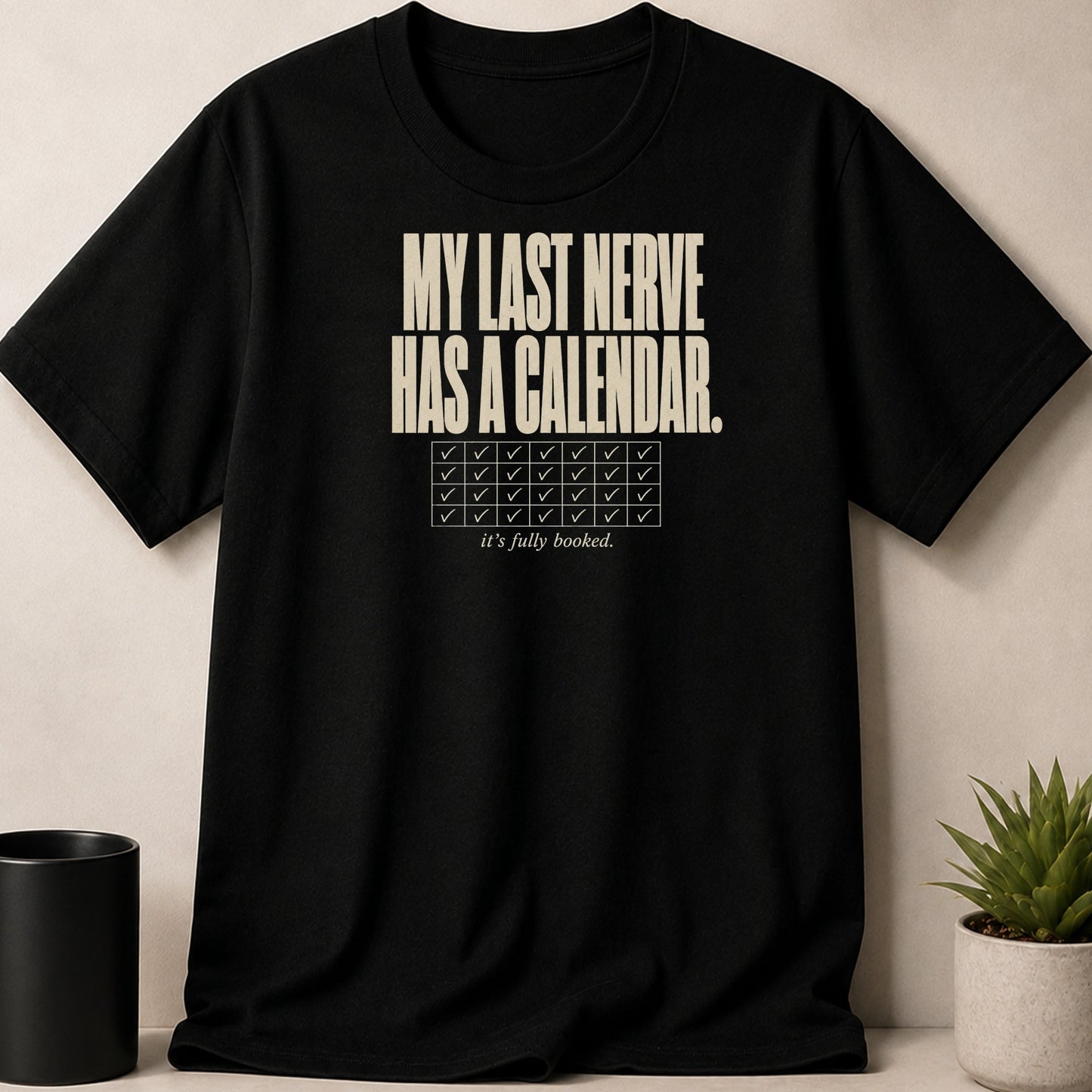 Black t-shirt with "MY LAST NERVE HAS A CALENDAR. it's fully booked." text.