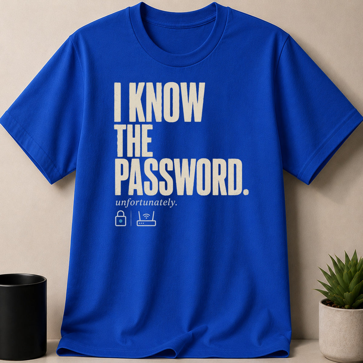 Blue t-shirt with cream text "I KNOW THE PASSWORD. unfortunately." and icons.