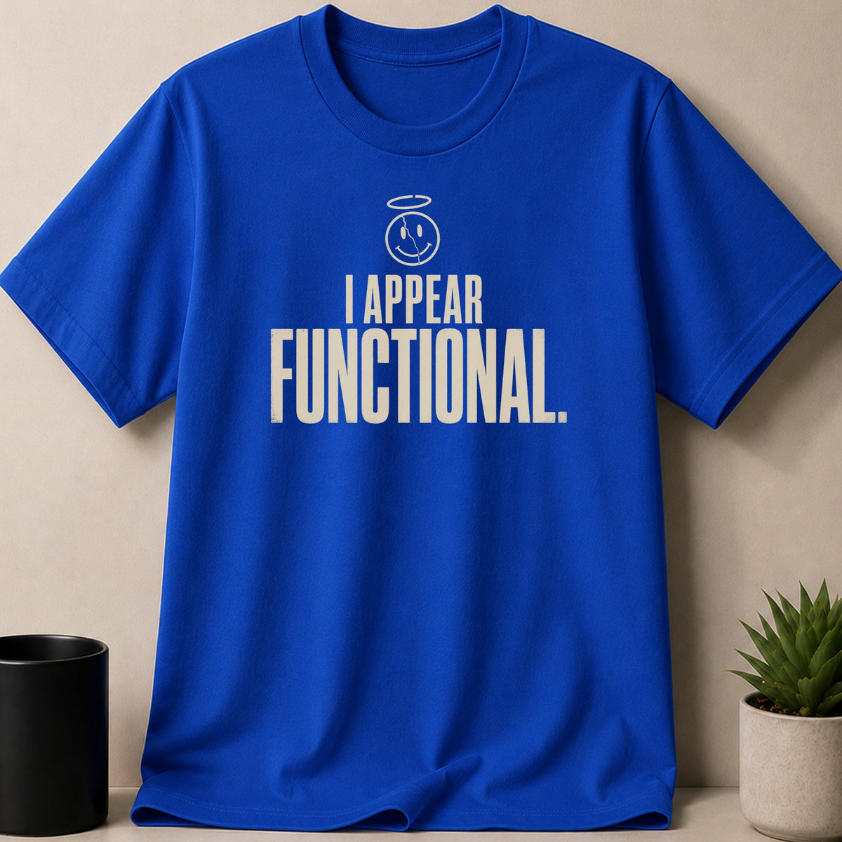 Blue t-shirt with white text and smiley face graphic.