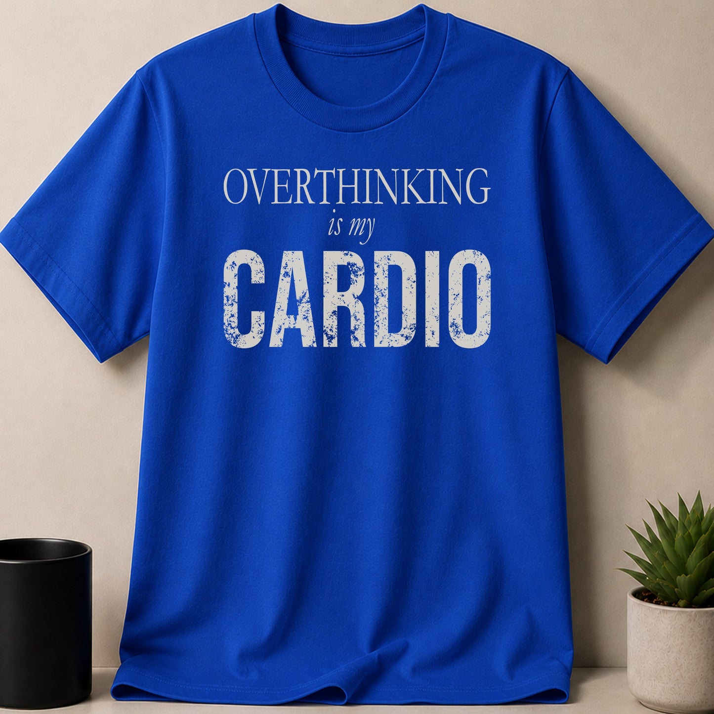 Blue t-shirt with white text: "OVERTHINKING is my CARDIO."
