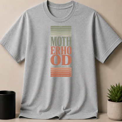 Grey t-shirt with "MOTHERHOOD" text and "terms apply" below.