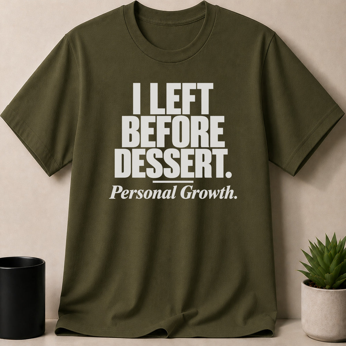 Olive green crewneck t-shirt featuring the white text I LEFT BEFORE DESSERT and Personal Growth.