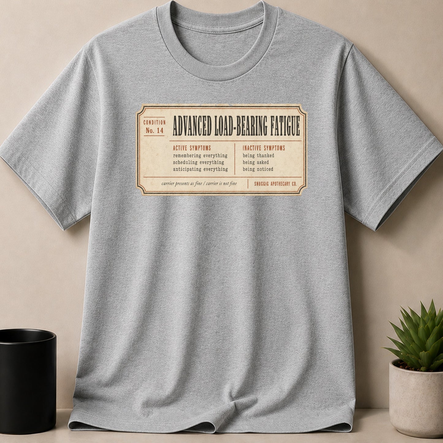 Grey t-shirt with text "Advanced Load-Bearing Fatigue" and fatigue symptoms.