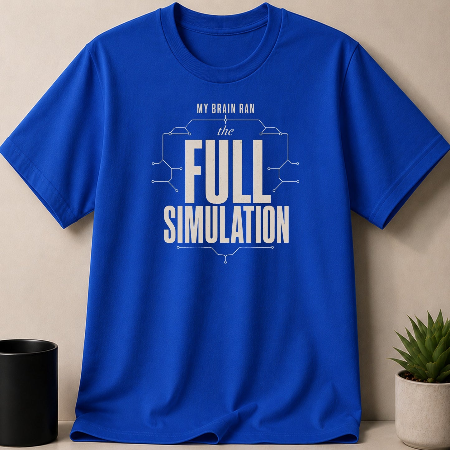 Blue t-shirt with "MY BRAIN RAN the FULL SIMULATION" text and circuit design.