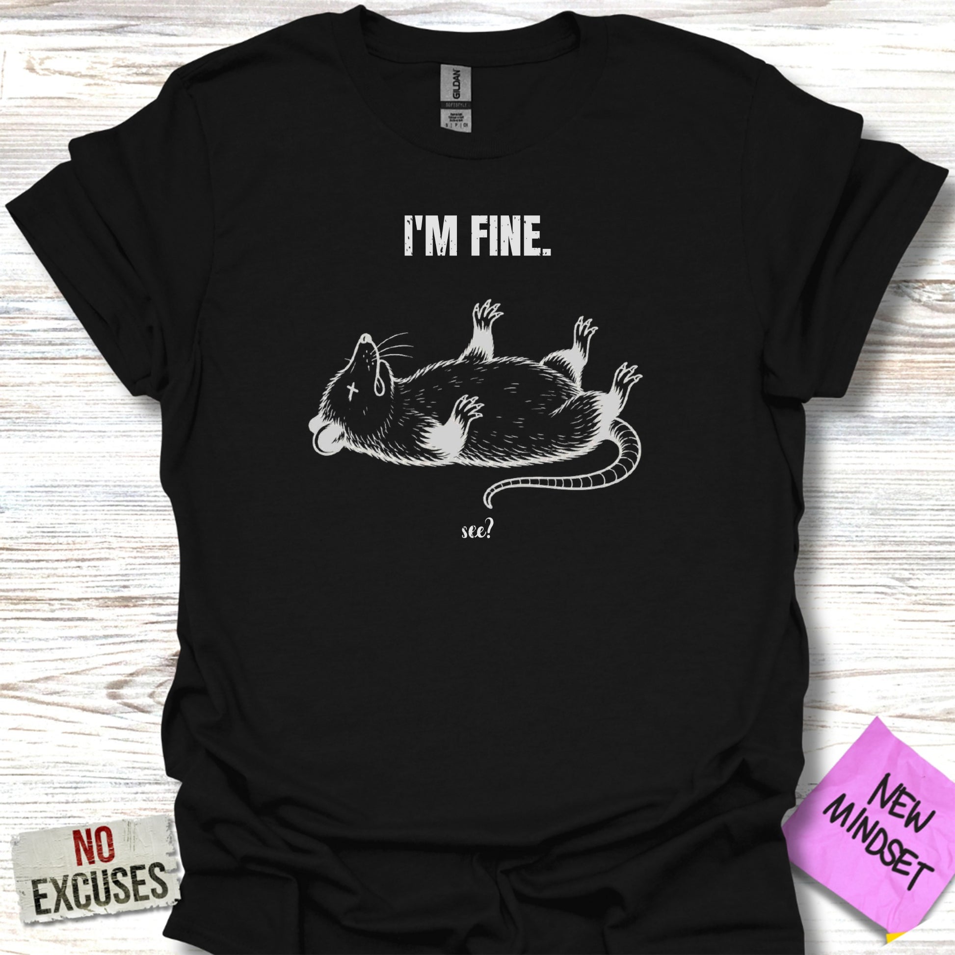 Black t-shirt with white graphic of a rat lying on its back, saying "I'm Fine. See?"