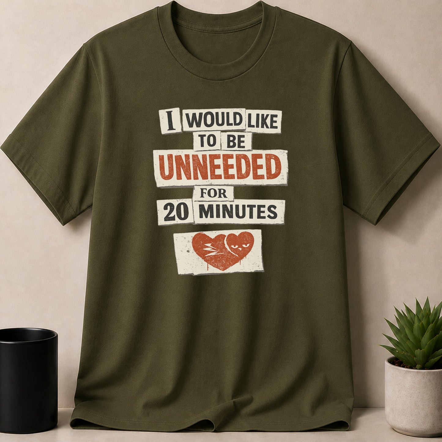 Green t-shirt with text: I would like to be unneeded for 20 minutes.