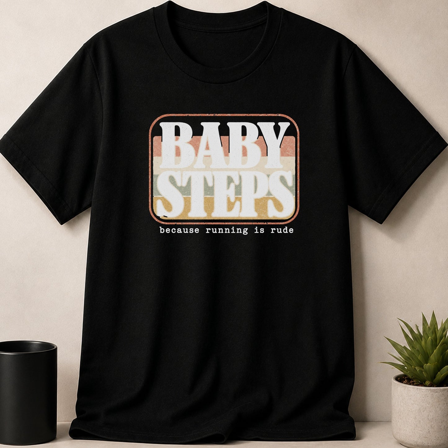 Black t-shirt with "BABY STEPS" and "because running is rude" text design.