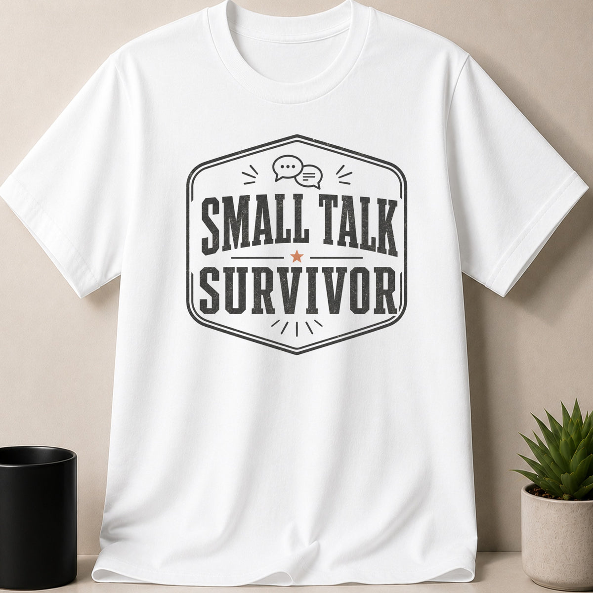 White t-shirt with distressed "SMALL TALK SURVIVOR" text and chat bubble graphic.