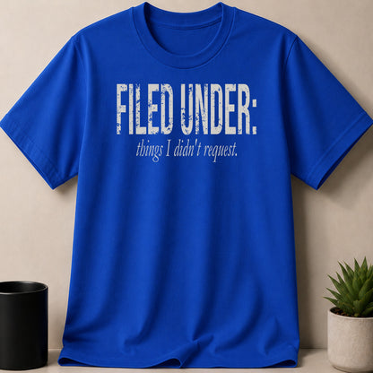 Royal blue t-shirt with distressed white text that reads "FILED UNDER: things I didn't request."