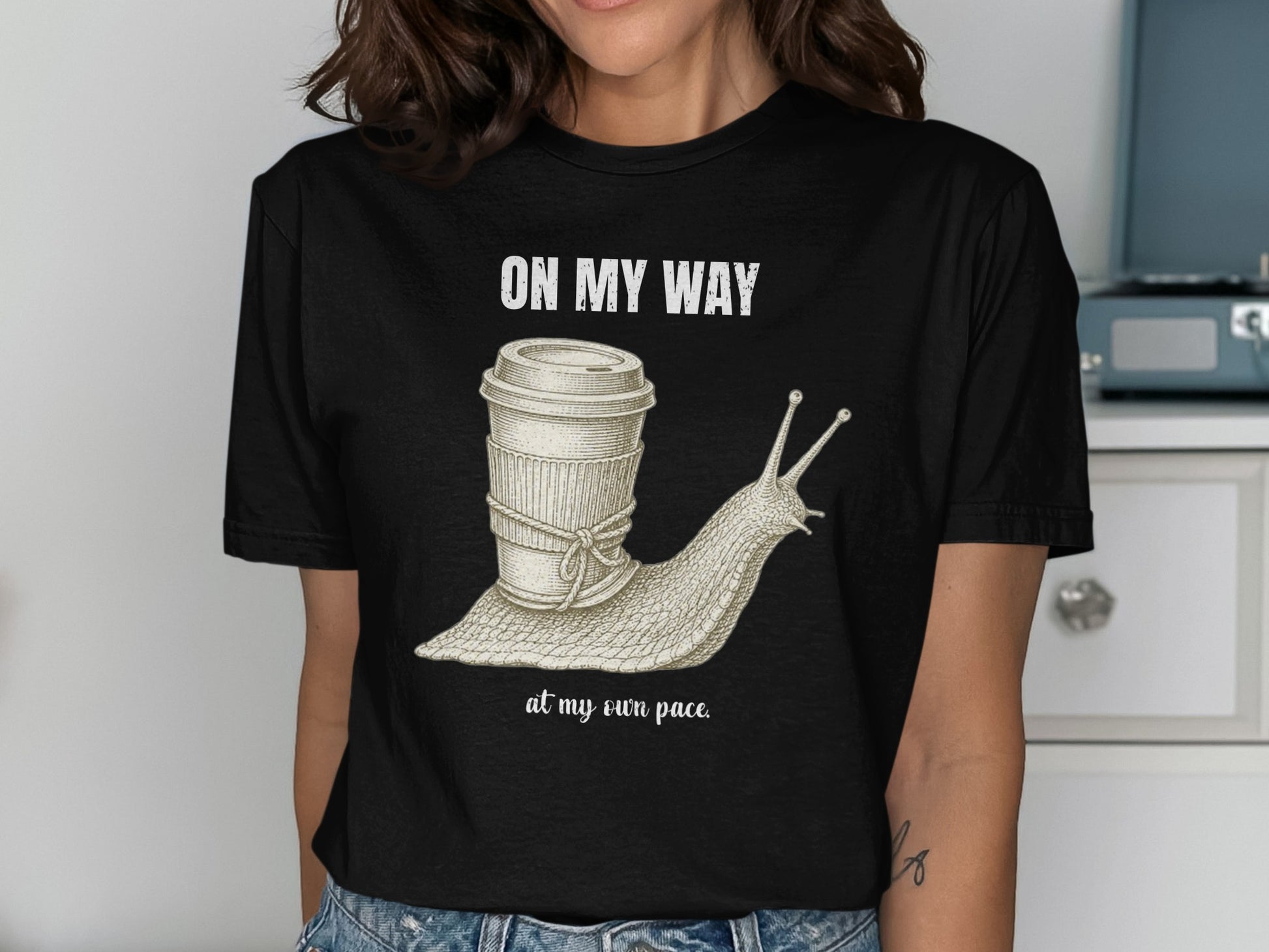 Snail with coffee cup on back, text "ON MY WAY at my own pace".
