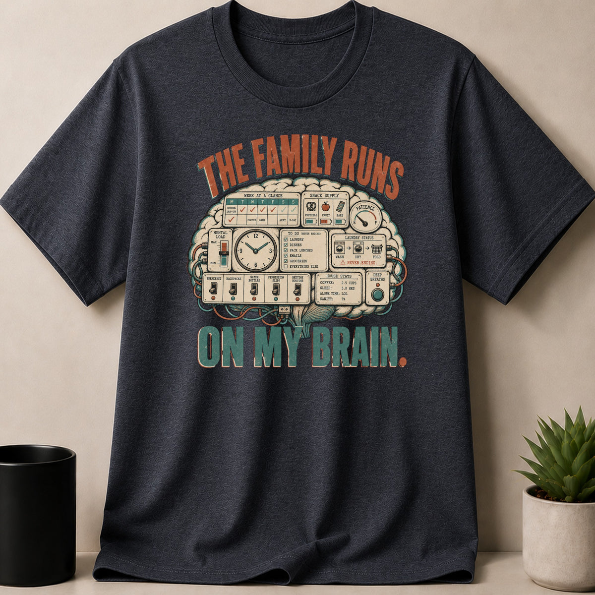 Dark grey t-shirt with text and graphic about "The Family Runs On My Brain".