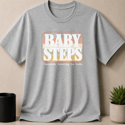 Grey t-shirt with "BABY STEPS because running is rude" graphic.