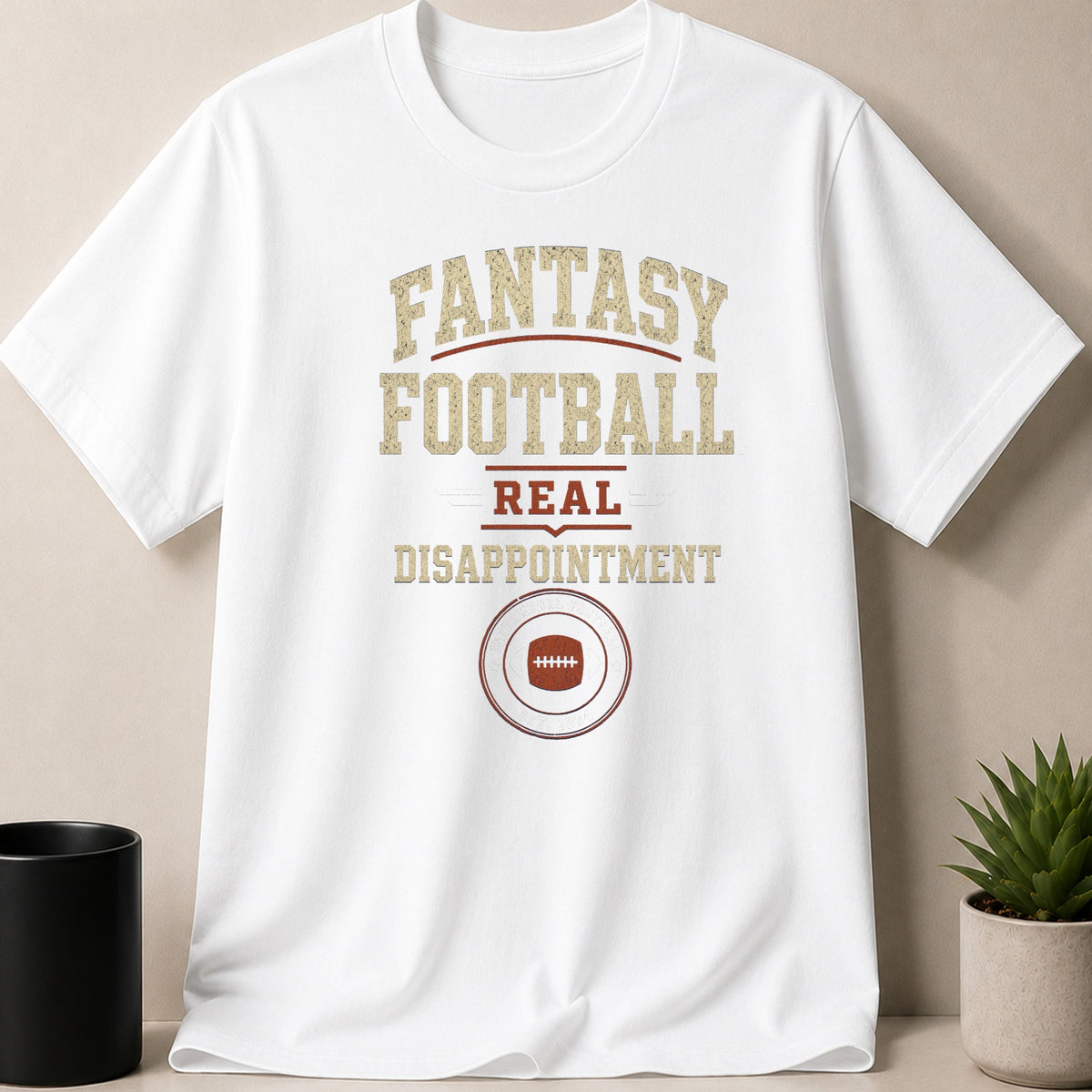 White t-shirt with "Fantasy Football Real Disappointment" text and football graphic.