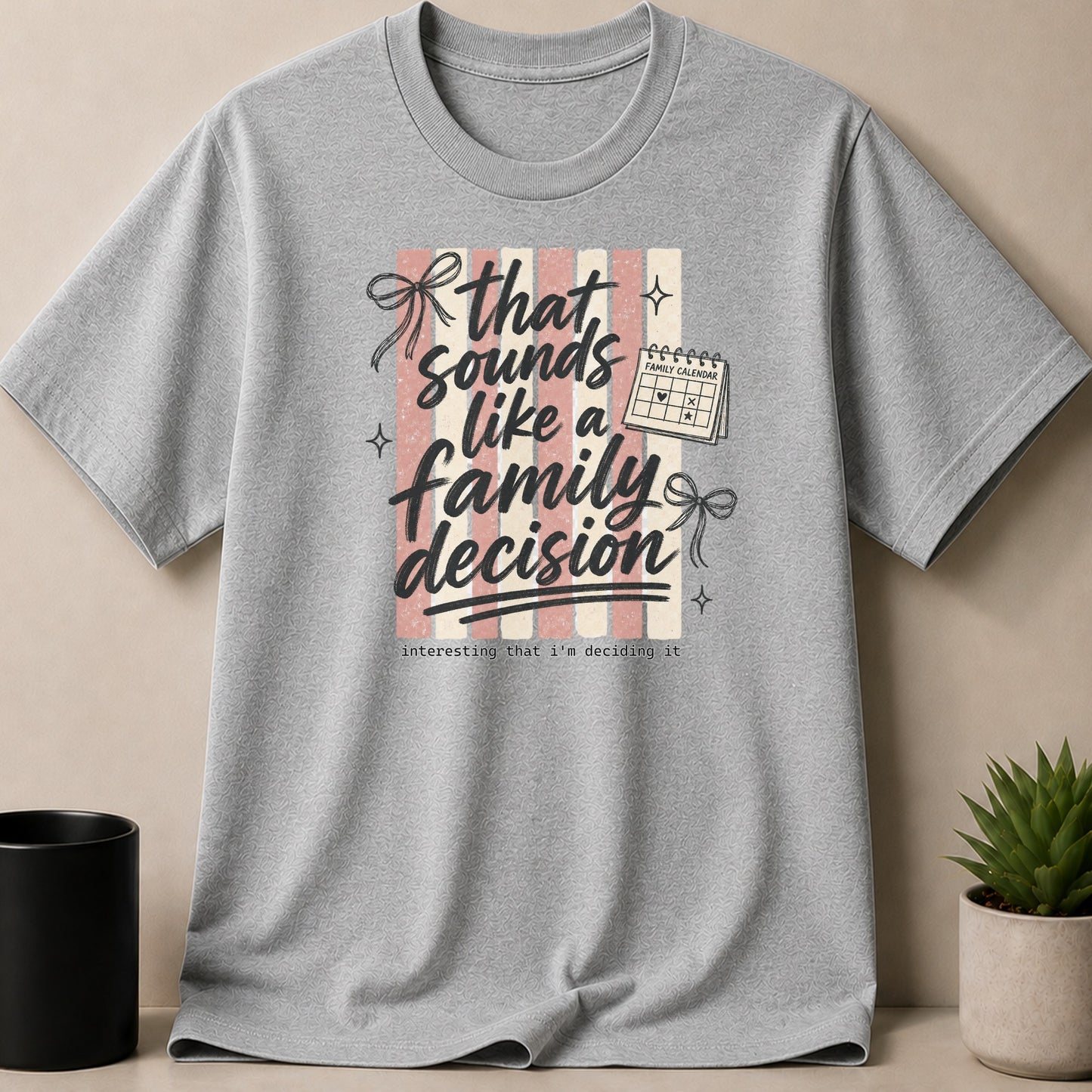 Grey t-shirt with "that sounds like a family decision" text and calendar graphic.