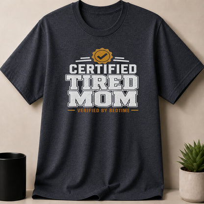 Dark gray t-shirt with "Certified Tired Mom Verified by Bedtime" graphic.