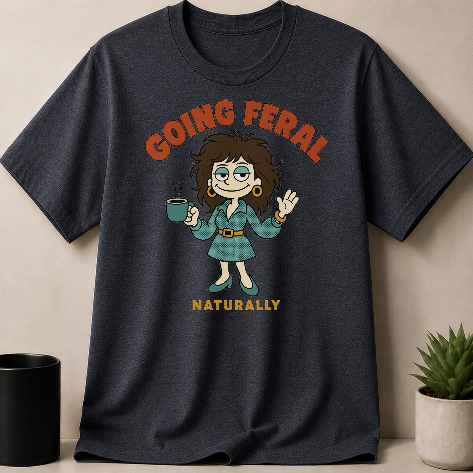 Dark gray t-shirt with "GOING FERAL NATURALLY" graphic and cartoon character.