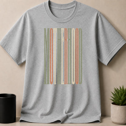 Grey t-shirt with vertical "MOTHERHOOD" text in muted colors.