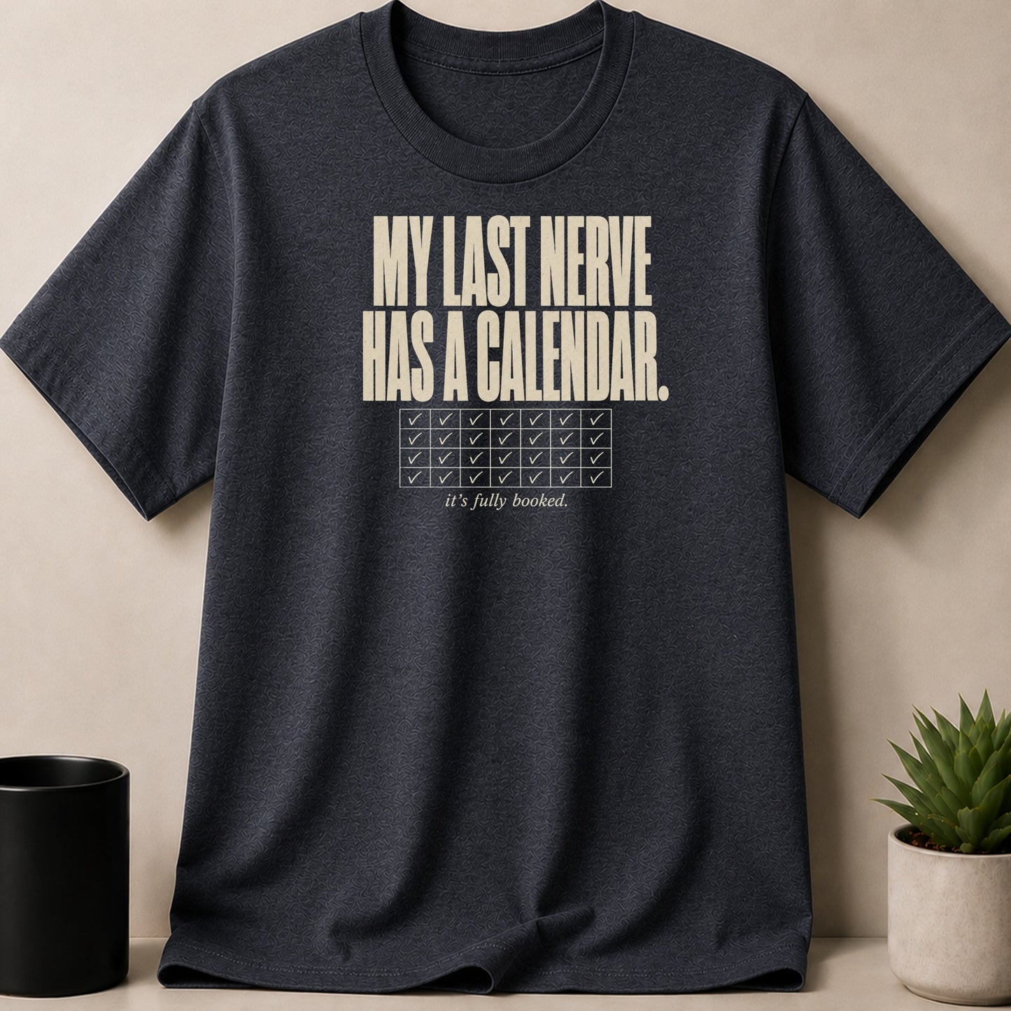 Dark t-shirt with "MY LAST NERVE HAS A CALENDAR. it's fully booked." text.
