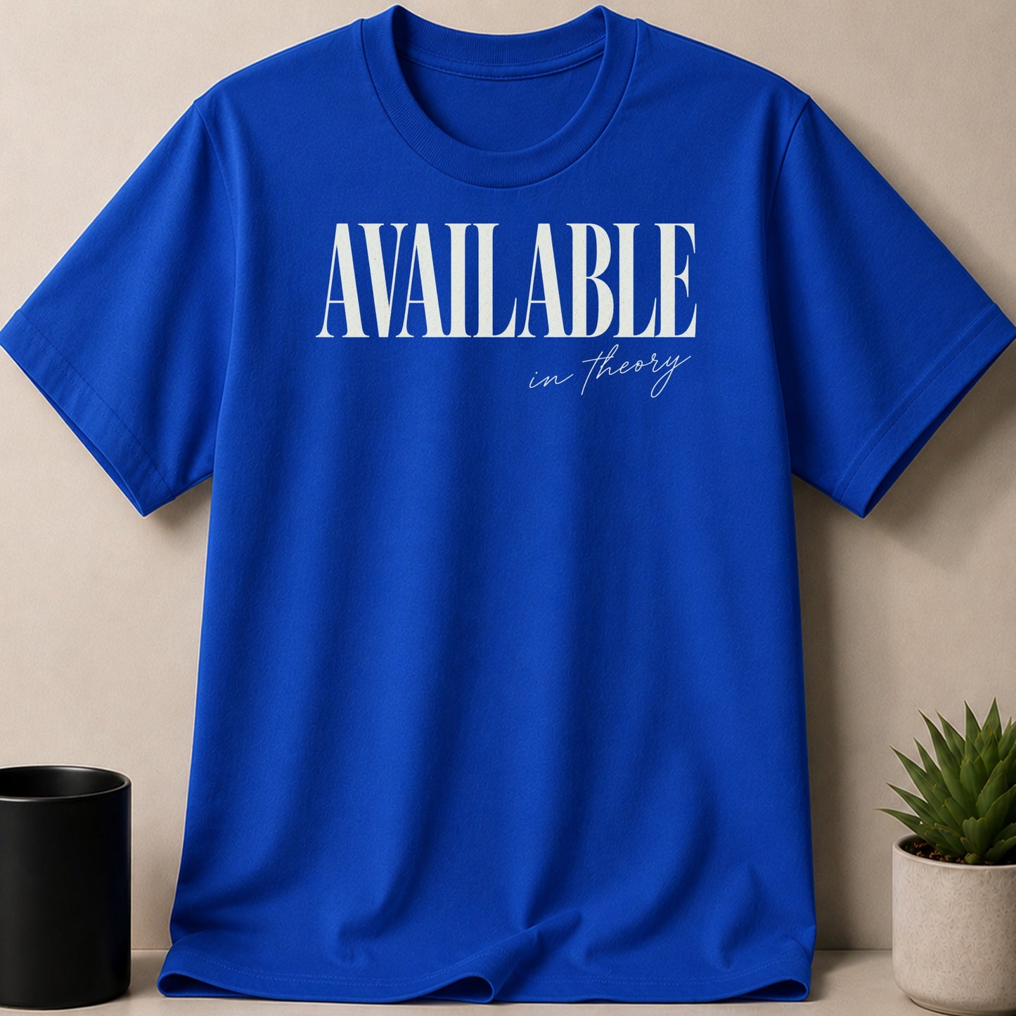 Blue t-shirt with "AVAILABLE in theory" text in white.
