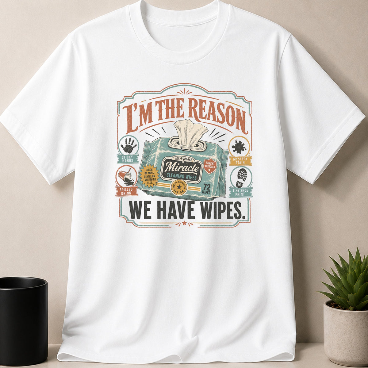 White t-shirt with graphic "I'm the reason we have wipes" and cleaning wipe illustrations.