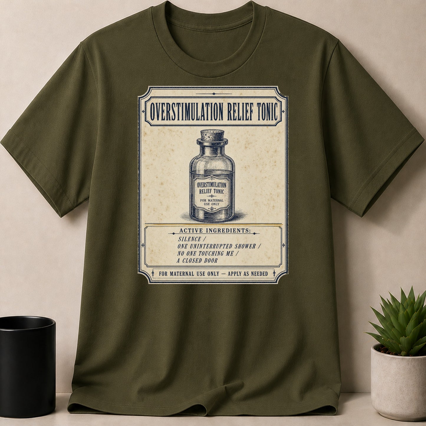Green T-shirt with "Overstimulation Relief Tonic" vintage label design.