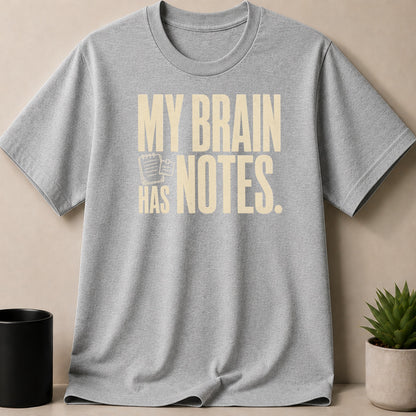 Grey t-shirt with "MY BRAIN HAS NOTES." printed in cream.