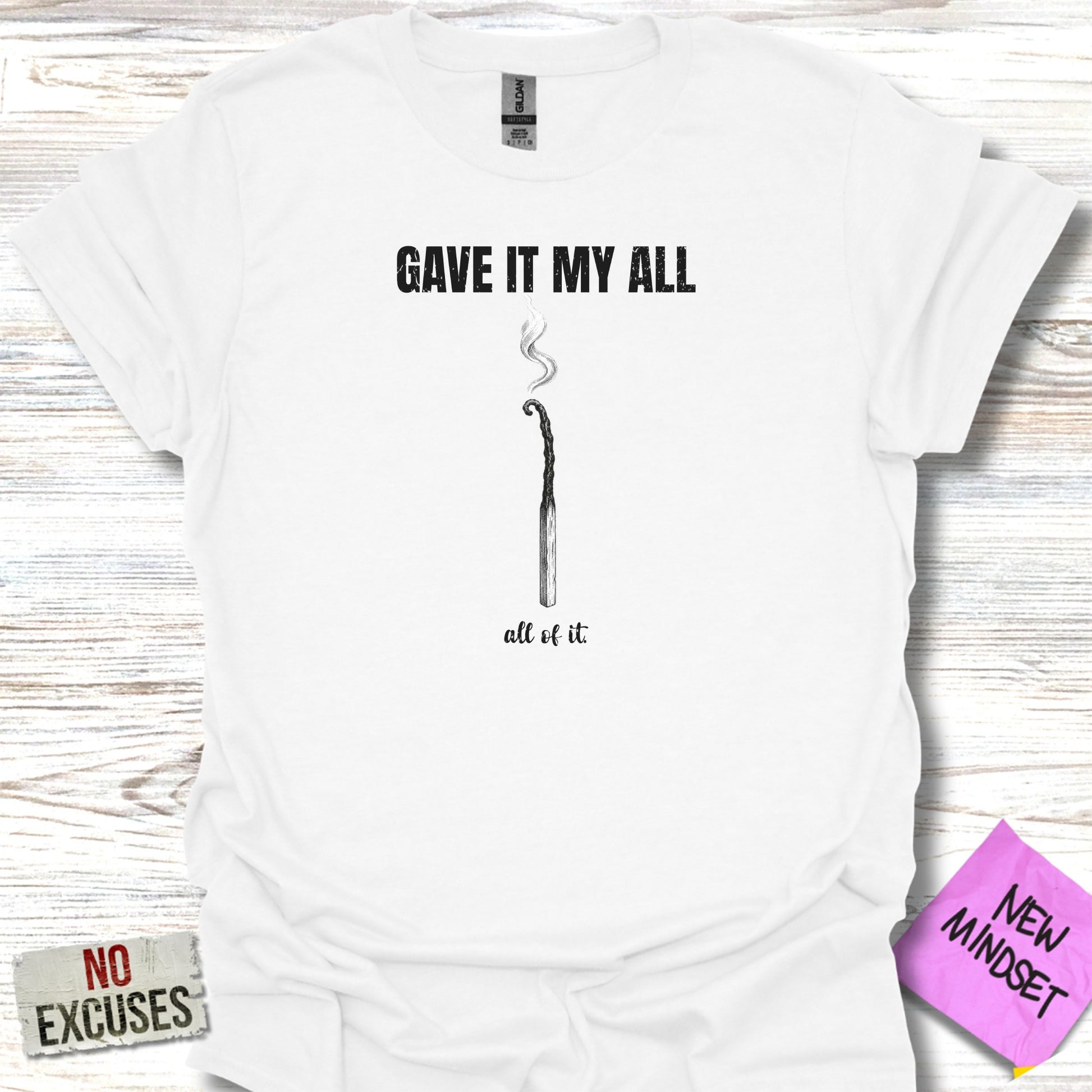 White t-shirt with "GAVE IT MY ALL all of it." text and burnt match.