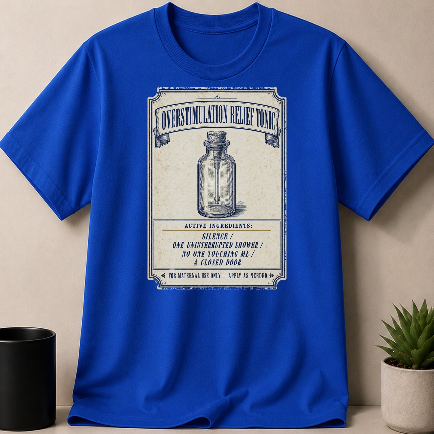 Blue t-shirt with vintage "Overstimulation Relief Tonic" label and ingredients.