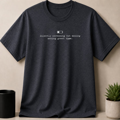 Dark grey t-shirt with a low battery icon and the text "Silently screaming but making great time."