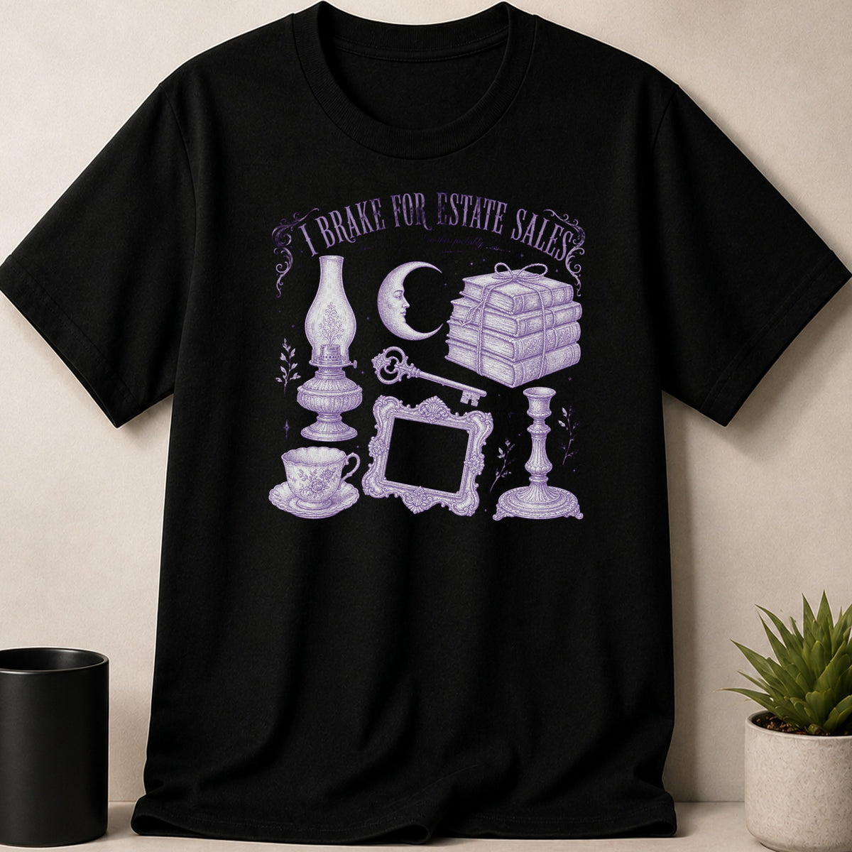 Black t-shirt with purple graphic: "I Brake for Estate Sales" and vintage items.