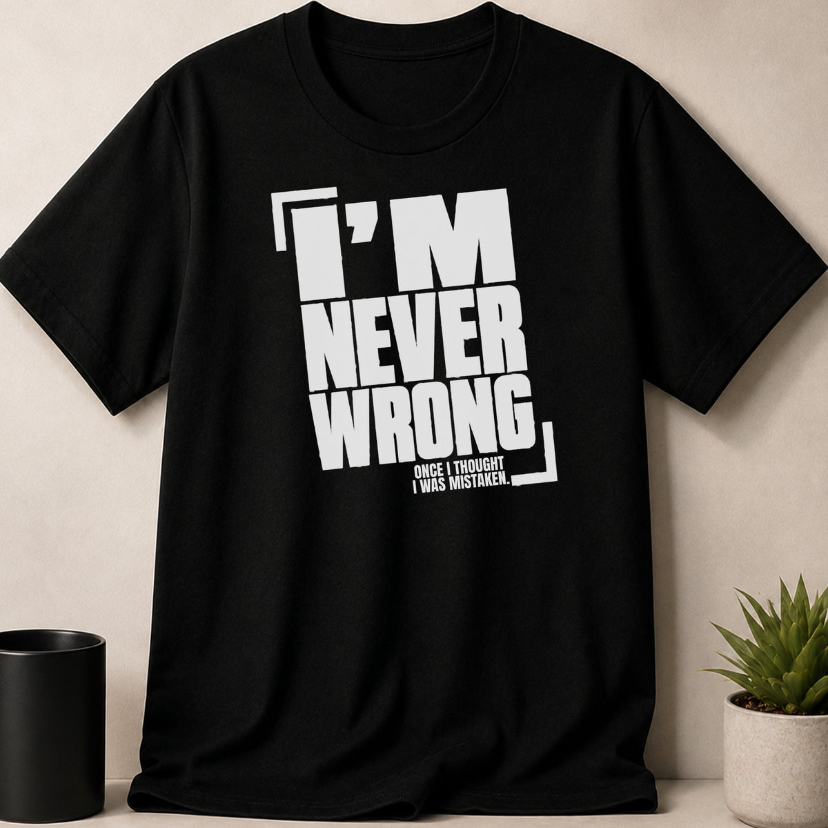 Black t-shirt with white text "I'm never wrong, once I thought I was mistaken."