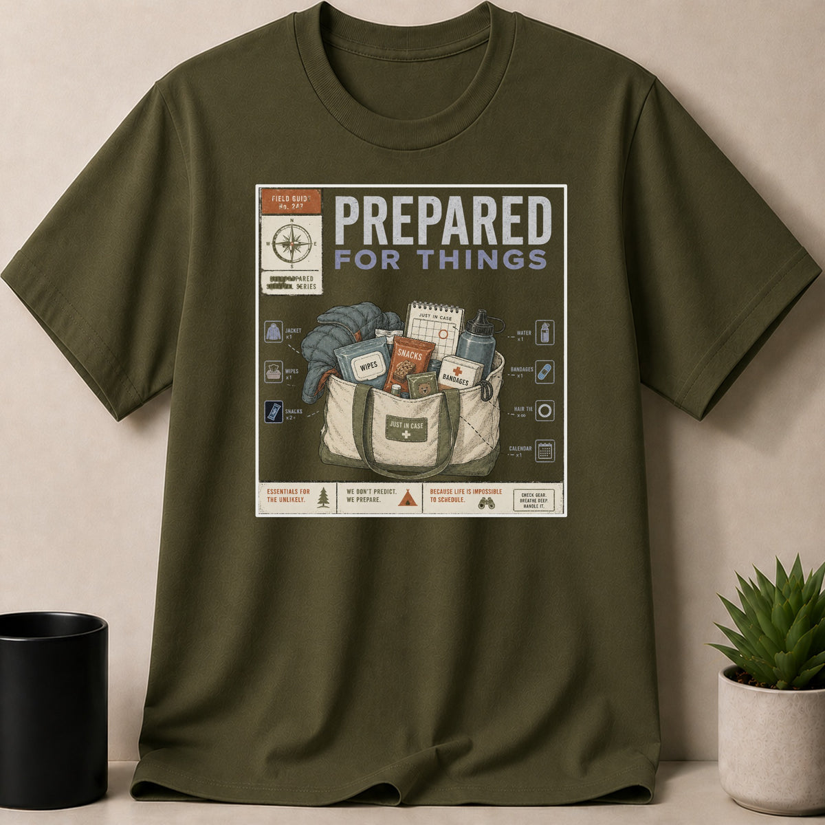 Military Green t-shirt — T-shirt graphic with "Prepared for Things" text and survival bag illustration.