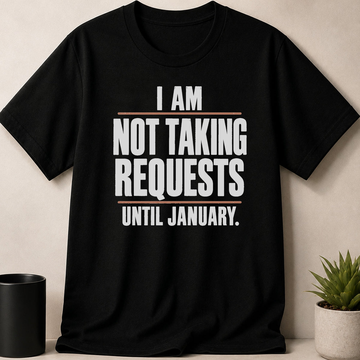 Black t-shirt featuring the white text I AM NOT TAKING REQUESTS UNTIL JANUARY.