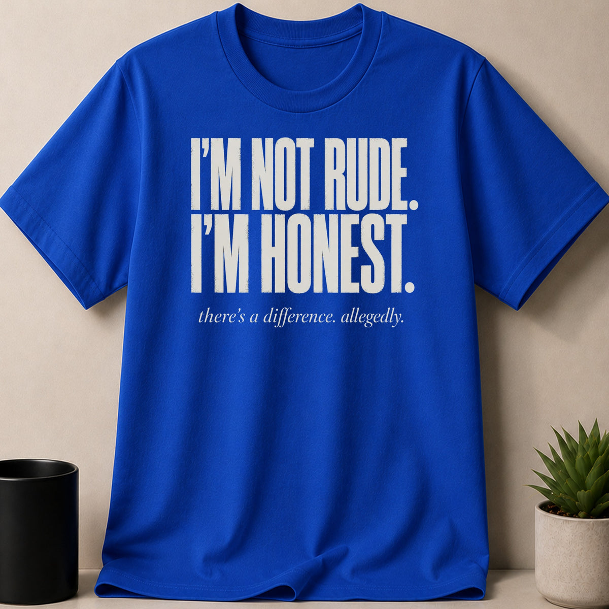 Blue t-shirt with white text "I'M NOT RUDE. I'M HONEST. there's a difference. allegedly."