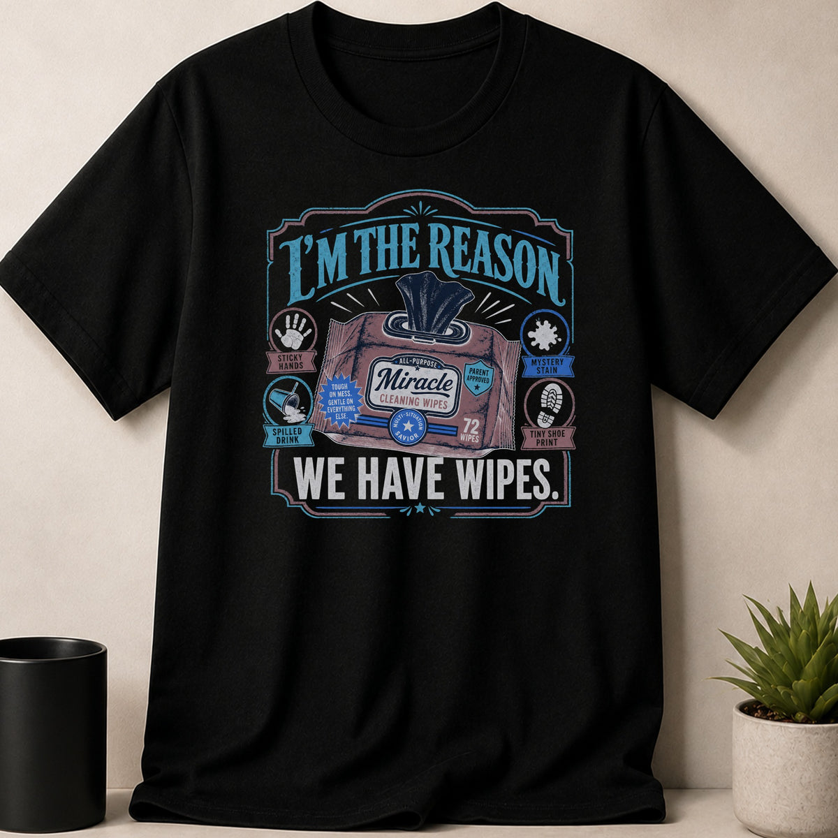 Black t-shirt with text "I'M THE REASON WE HAVE WIPES" and a wipes packet.