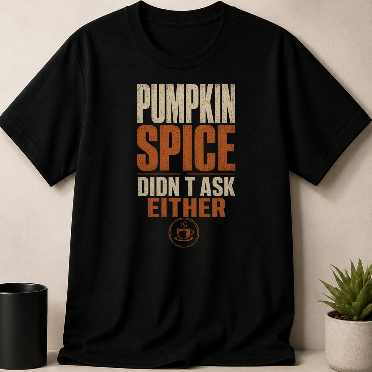 Black t-shirt with "Pumpkin Spice Didn't Ask Either" text and coffee cup graphic.