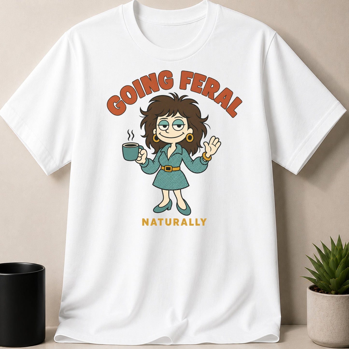 White t-shirt with graphic saying "GOING FERAl NATURALLY" and a woman with coffee.