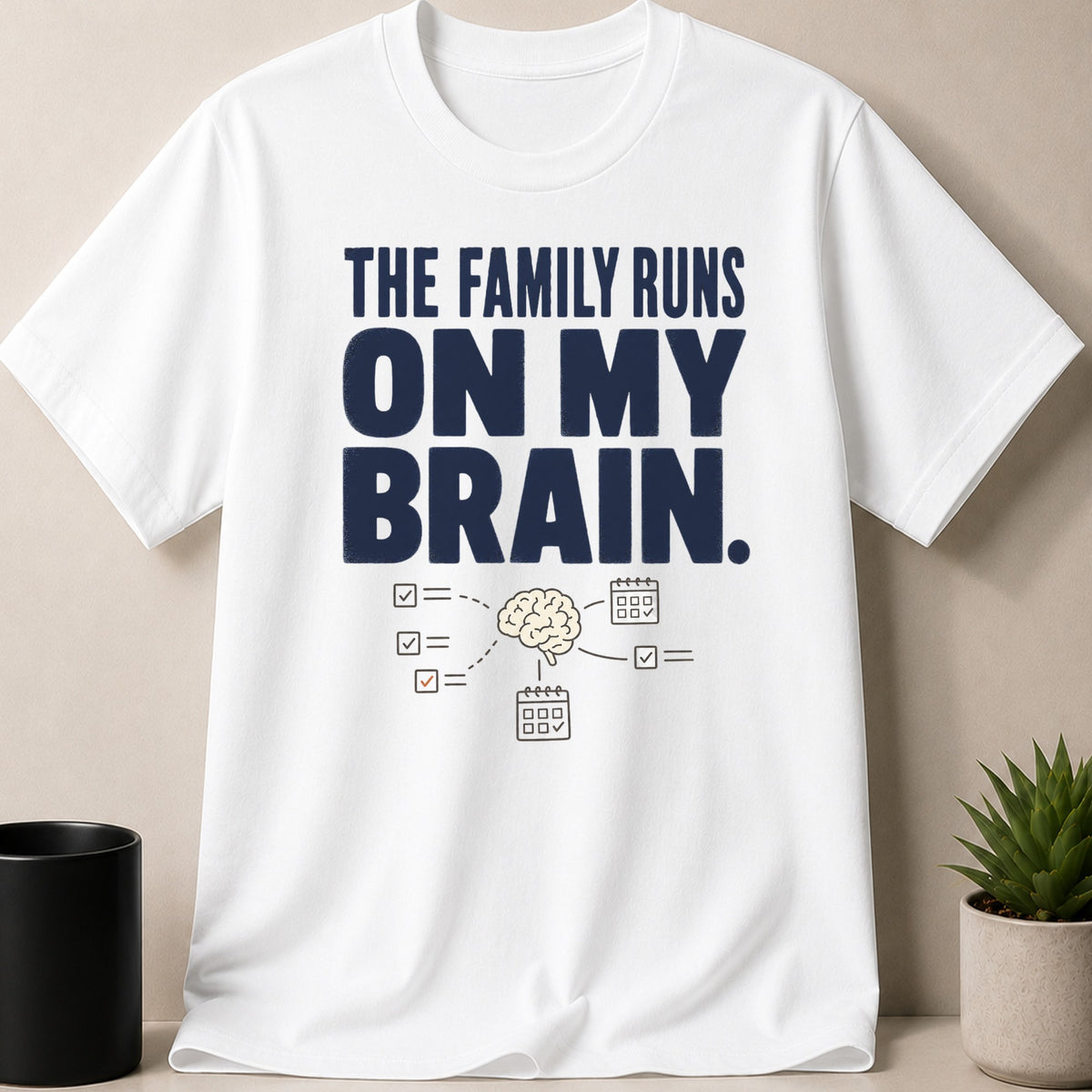 White t-shirt with navy text: "THE FAMILY RUNS ON MY BRAIN."