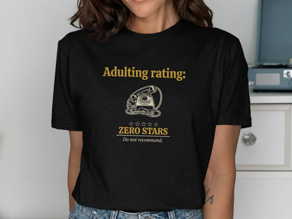 Black t-shirt with gold text "Adulting rating: Zero Stars, Do not recommend."