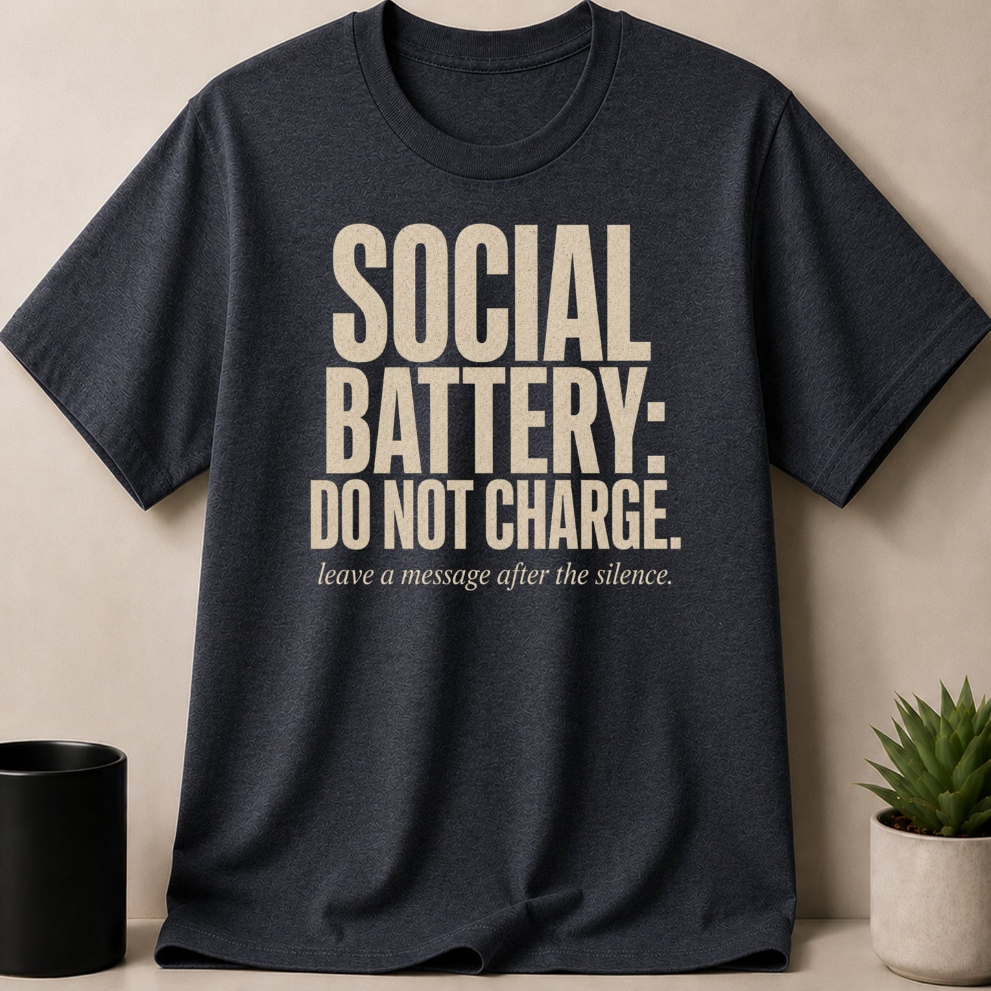 Dark grey t-shirt with "Social Battery: Do Not Charge" text.