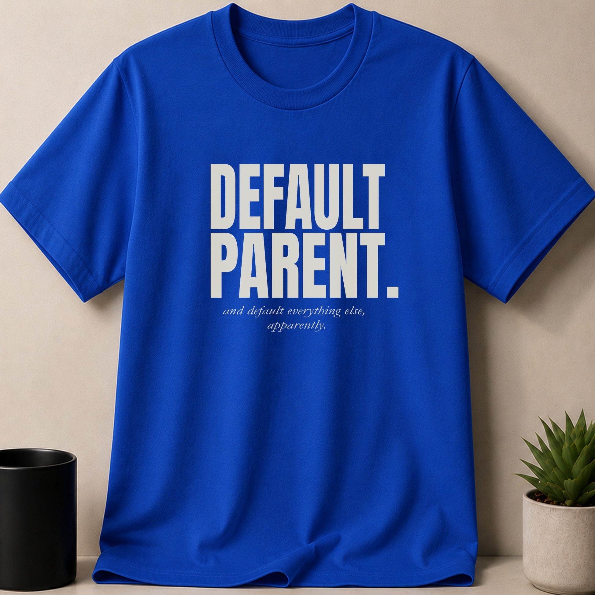 Blue t-shirt with "DEFAULT PARENT, and default everything else, apparently." text.