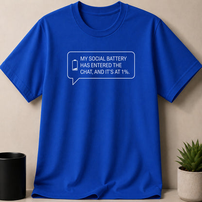 Royal blue t-shirt with white text: "MY SOCIAL BATTERY HAS ENTERED THE CHAT, AND IT'S AT 1%."