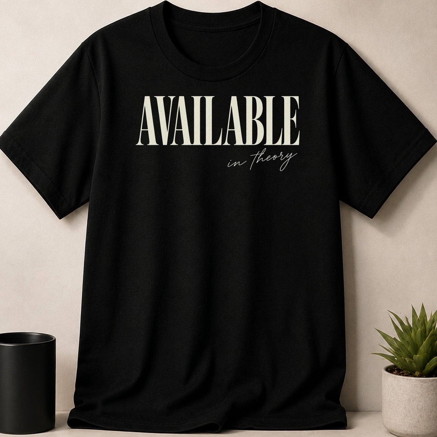 Black t-shirt with "AVAILABLE in theory" text in cream color.