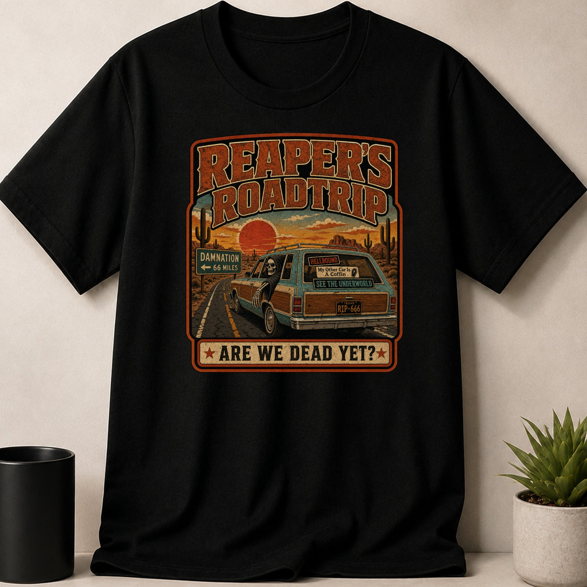 Black t-shirt — Shirt graphic: Reaper driving a station wagon on a desert road, "Reaper's Roadtrip" text.