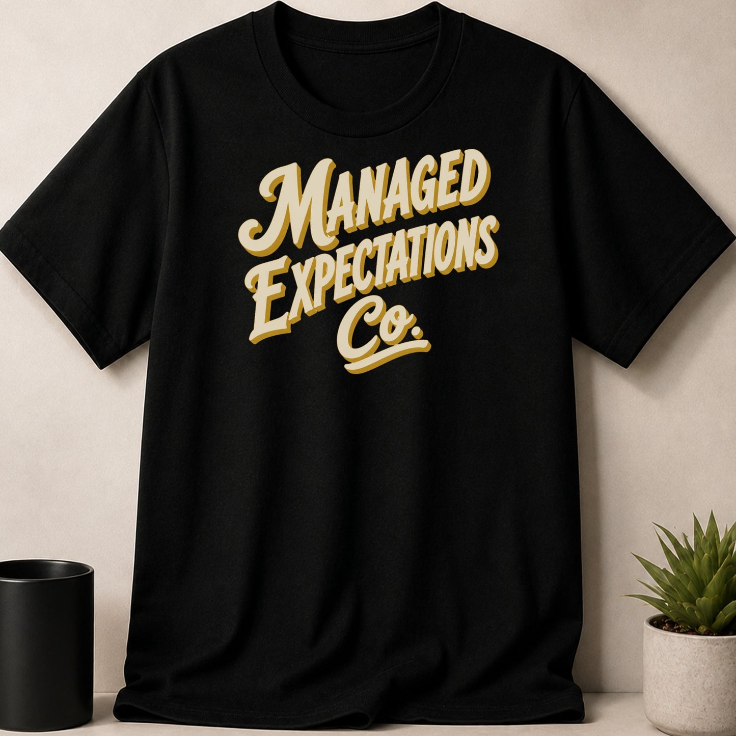 Black t-shirt with "MANAGED EXPECTATIONS Co." text in retro font.