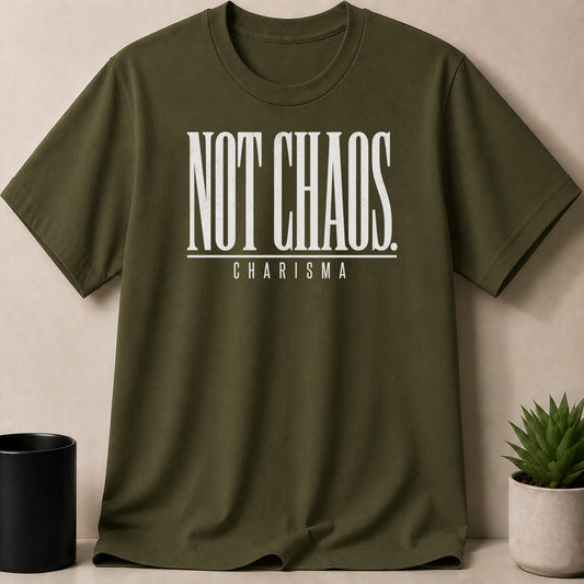 Olive green t-shirt with white text reading "NOT CHAOS" and "CHARISMA".