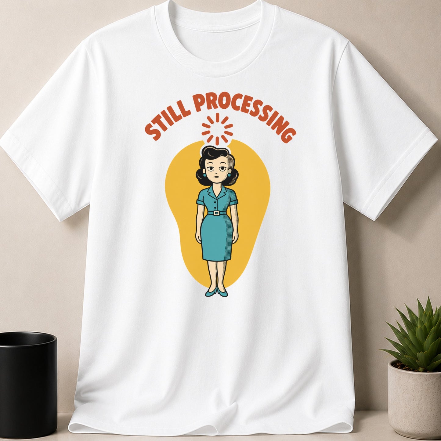 White t-shirt with cartoon woman and text "STILL PROCESSING"