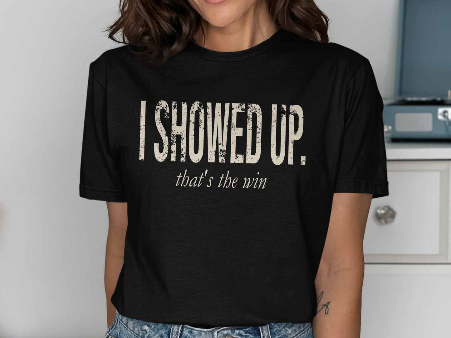 Black t-shirt with distressed "I SHOWED UP." and "that's the win" text.